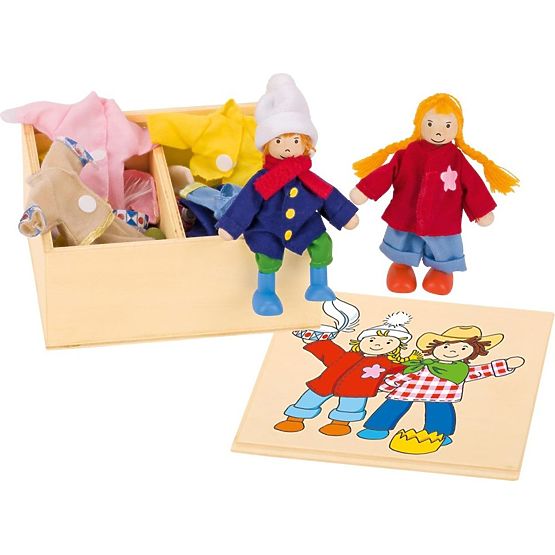 Dressing wooden dolls