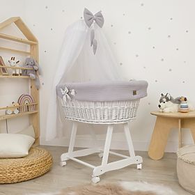 White wicker bed with equipment for a baby - Hedgehog